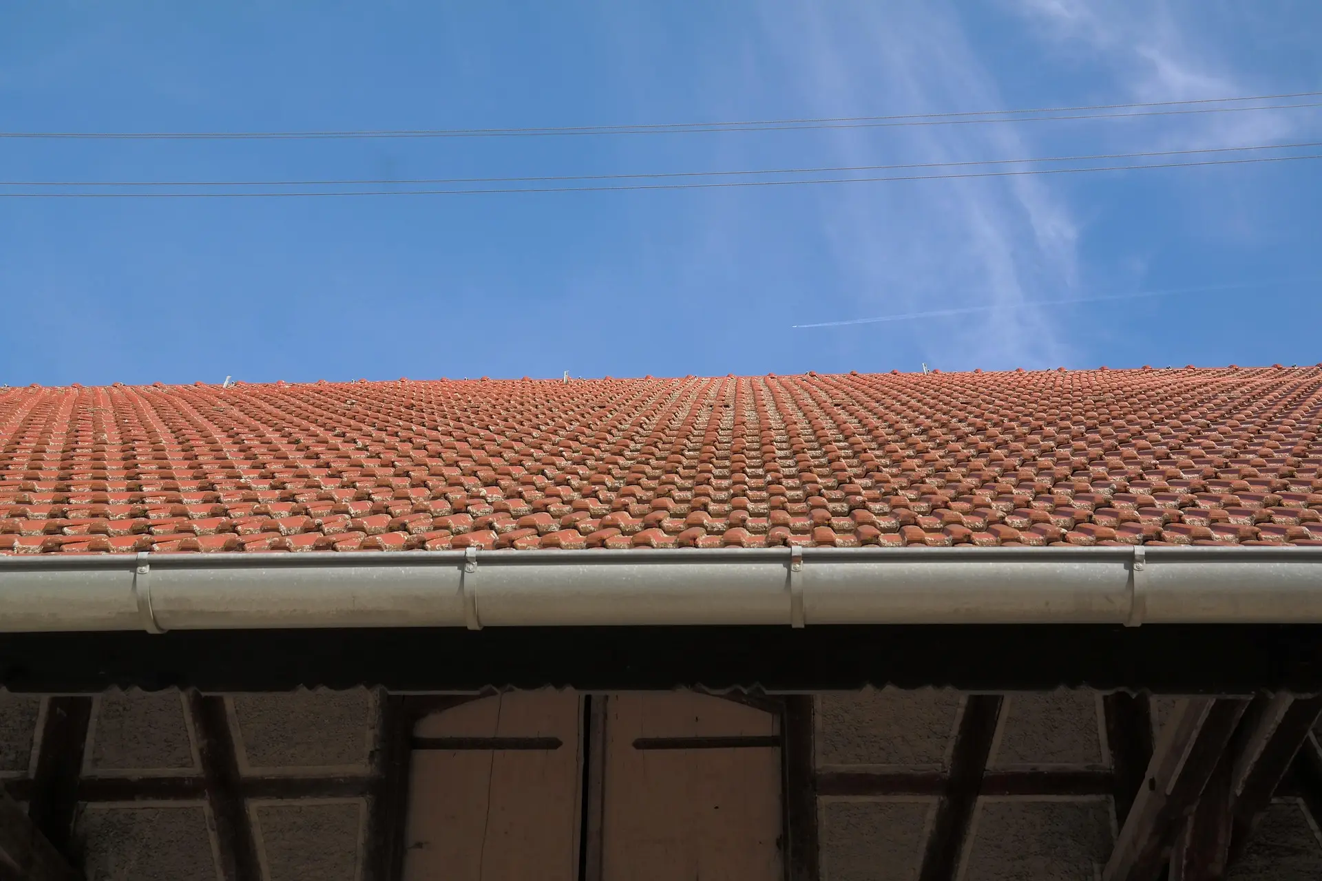 Commercial seamless gutter system installed by Zenic Industries in Southern Utah